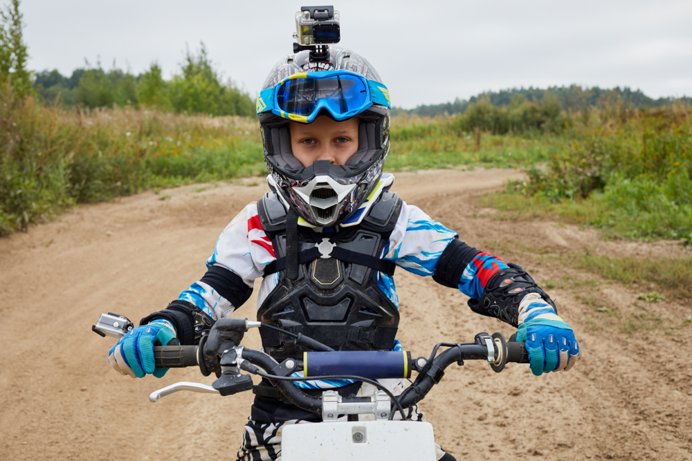 Young motorcycle rider on starter dirt bike