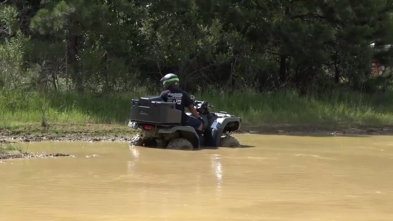 ATV rider stuck in muddy water