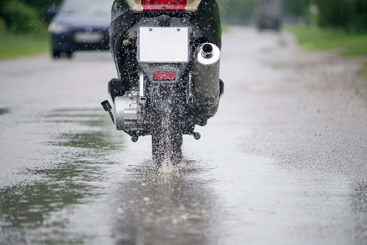 Motorcycle riding in rain