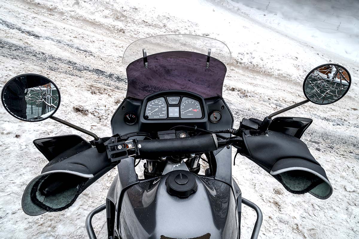 Motorcycle riding in snow slush black ice