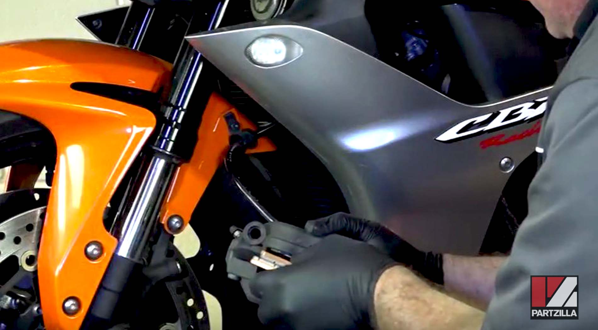 Honda motorcycle front brake pads replacement