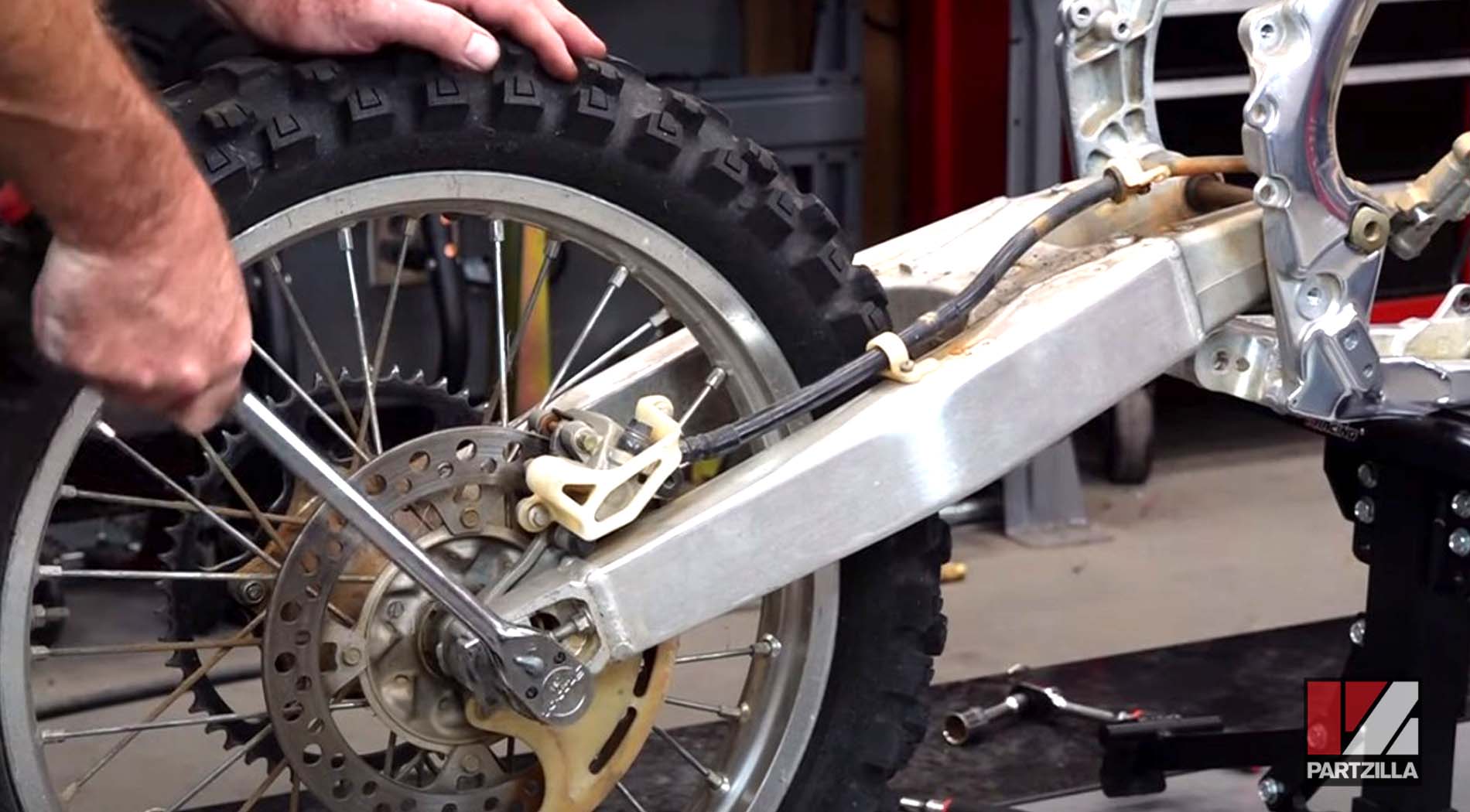 Honda CRF450 swingarm bearings replacement tire removal