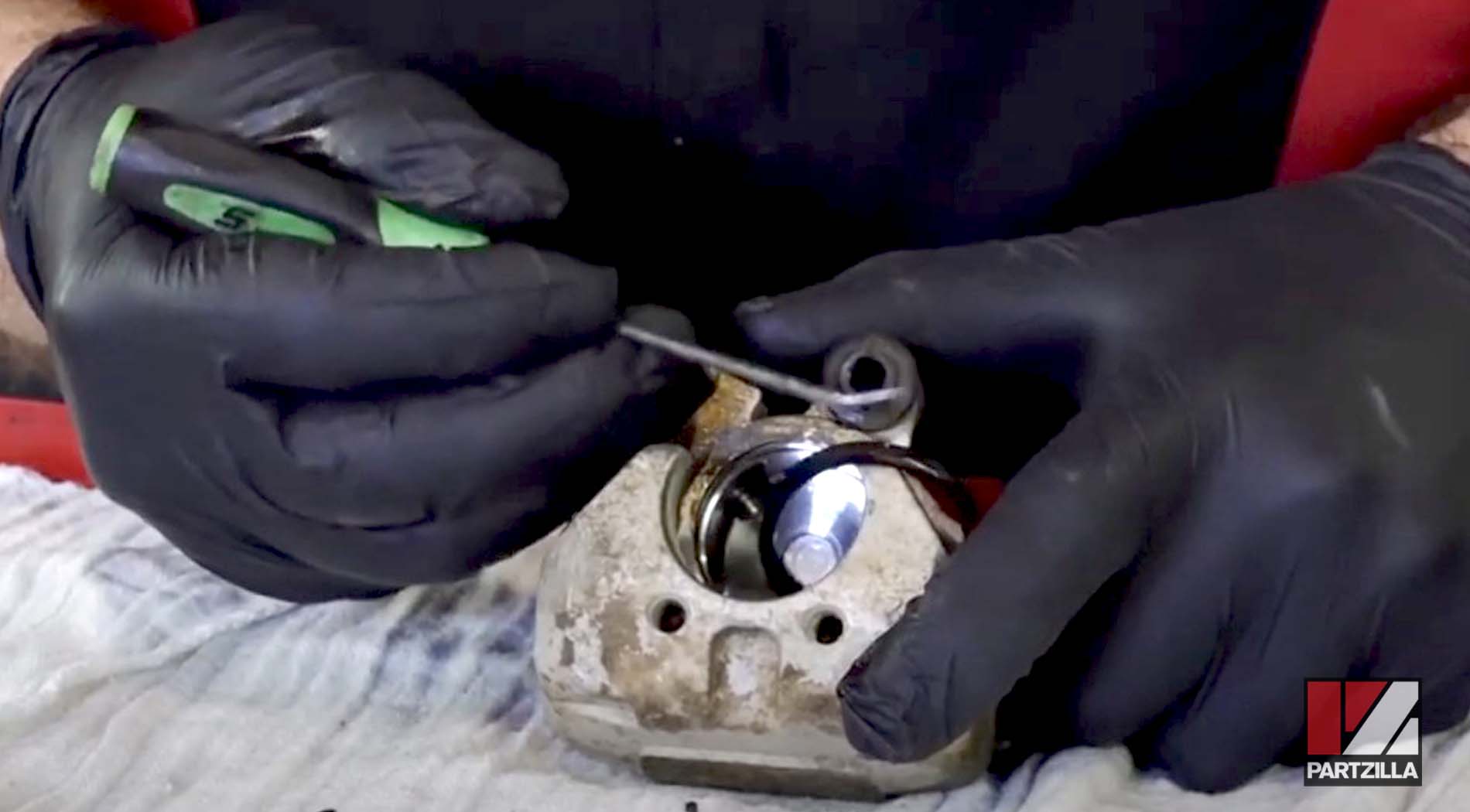 Honda TRX400 front brake caliper piston seals removal