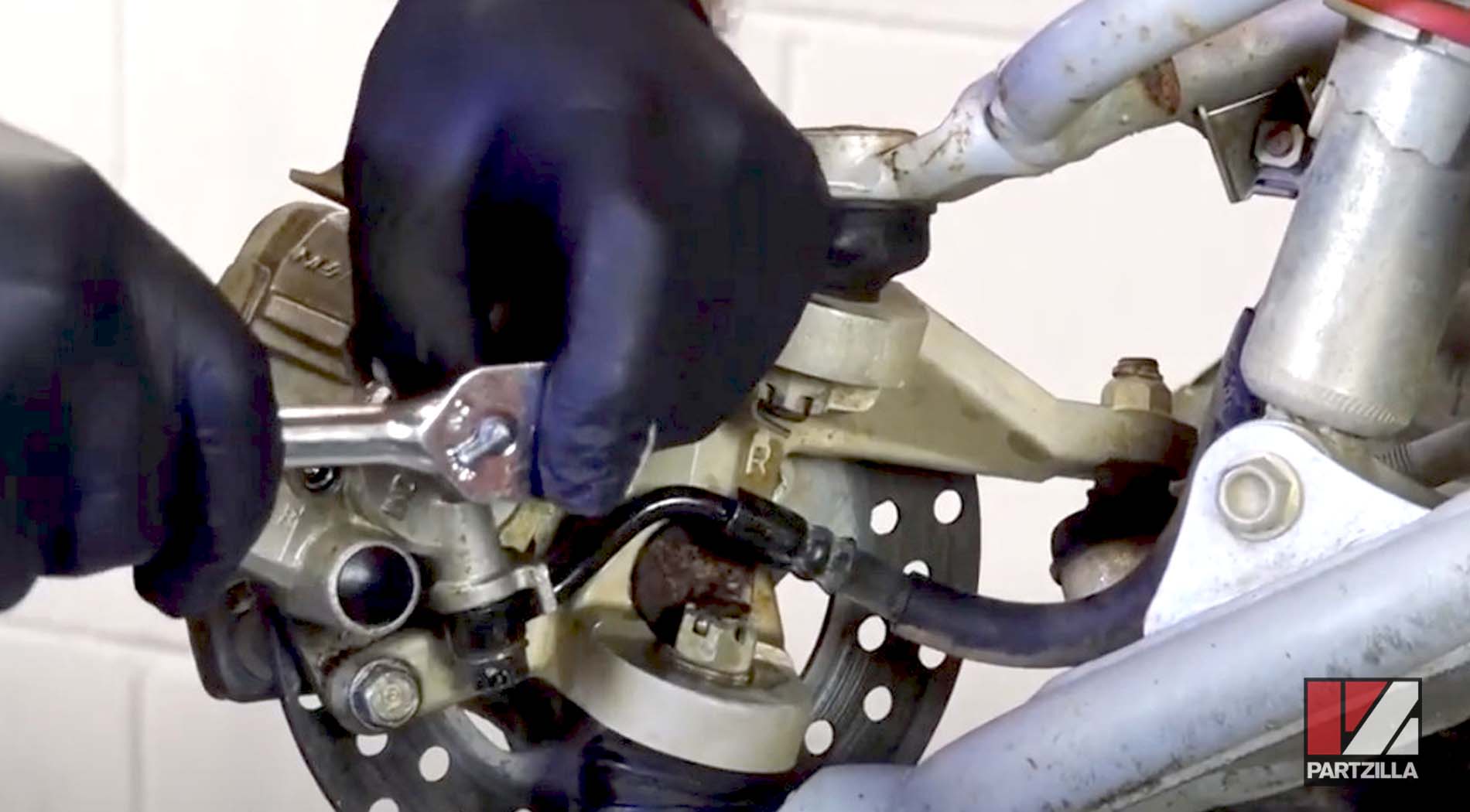 Honda TRX400 front brake caliper removal