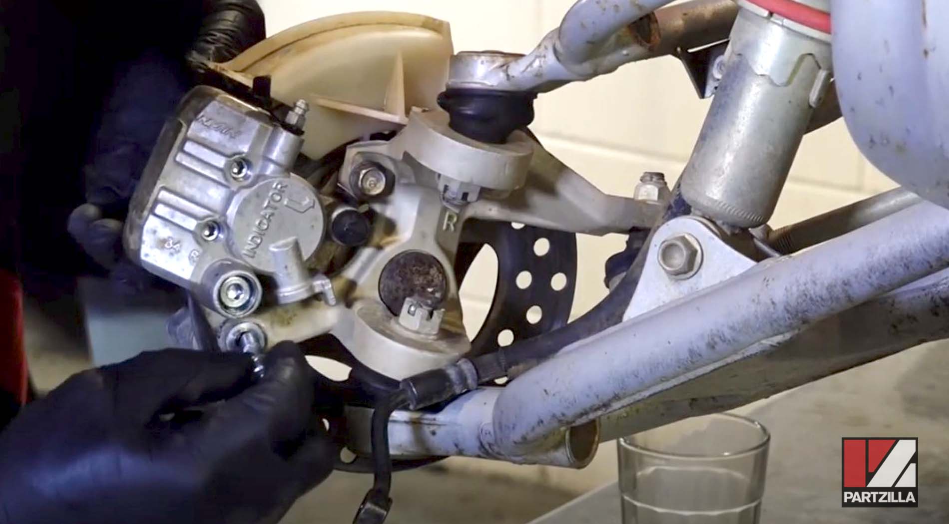Honda TRX400 brake caliper assembly
