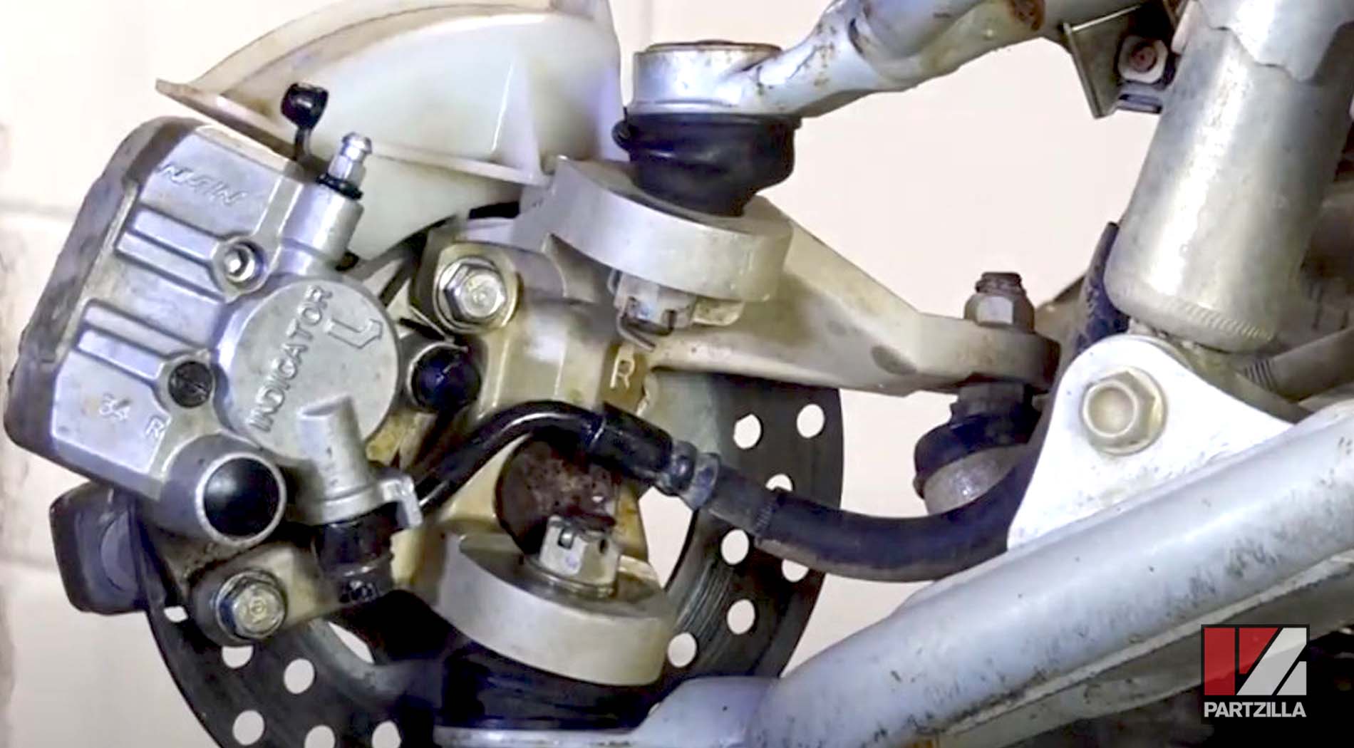 Honda TRX400 front brake caliper rebuild