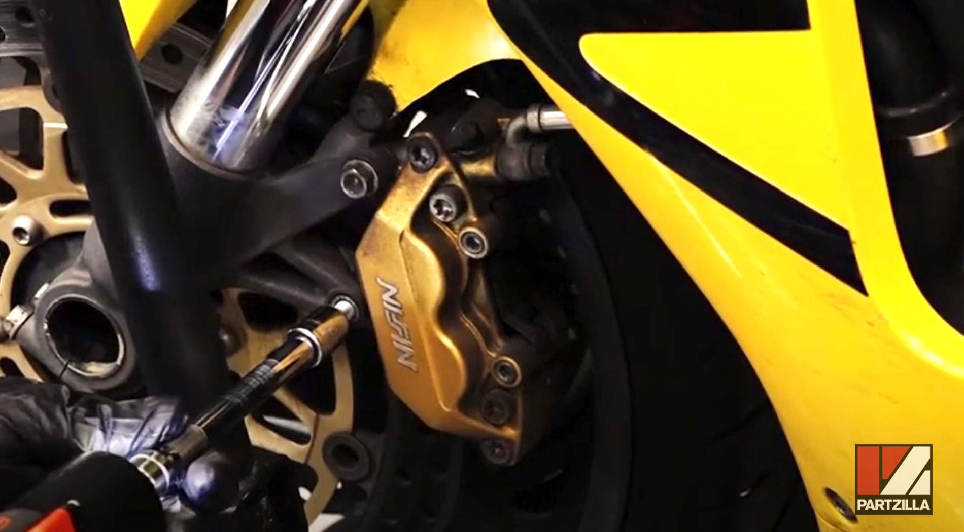 Honda CBR front tire caliper mounting