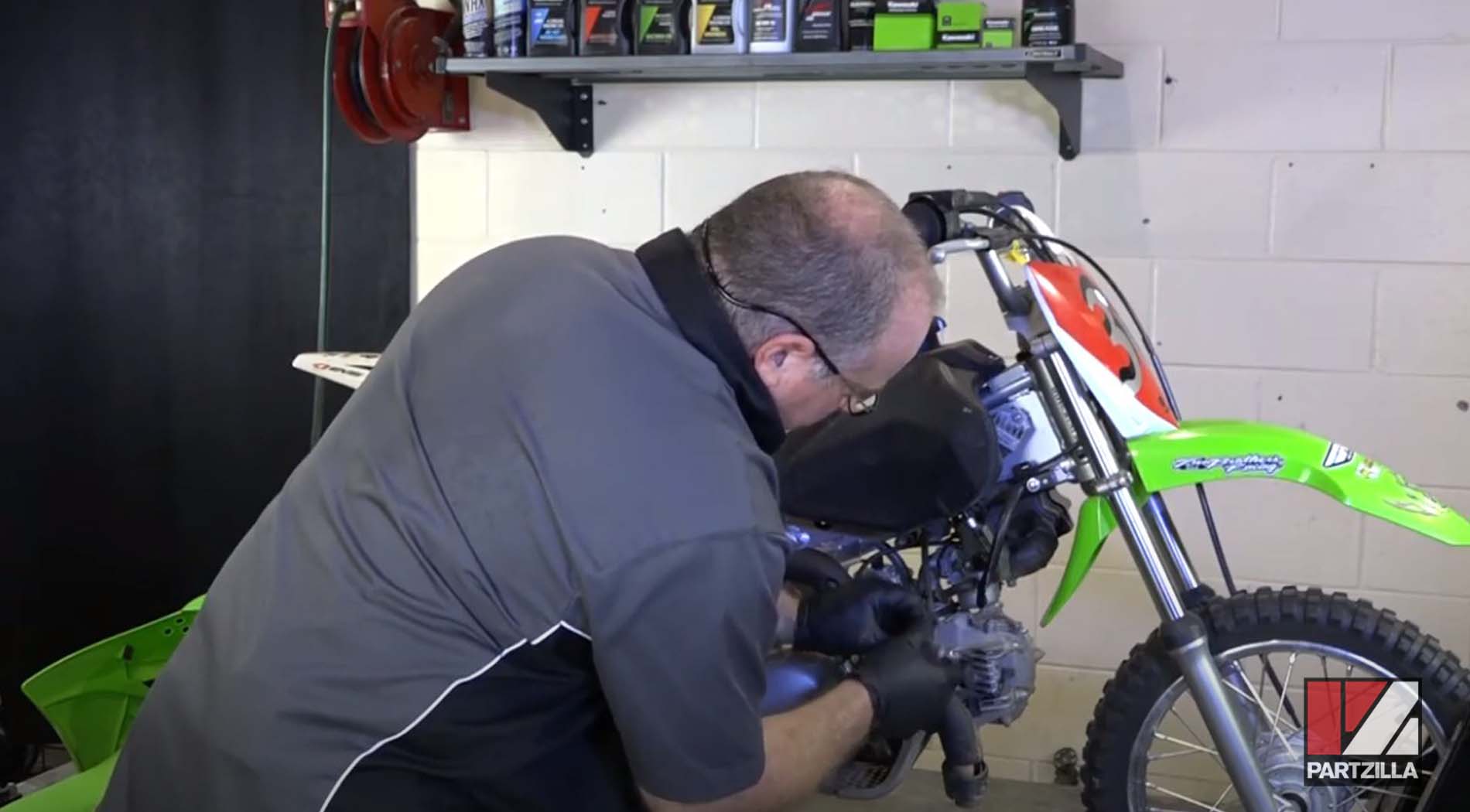 Kawasaki dirt bike battery spark plug change