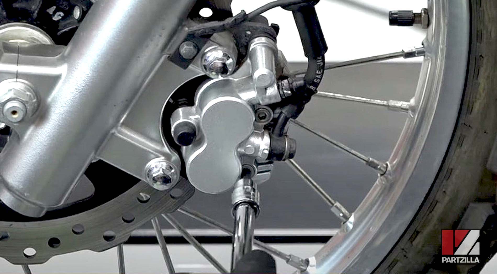 How to change Kawasaki KLR650 dual sport bike front brake pads