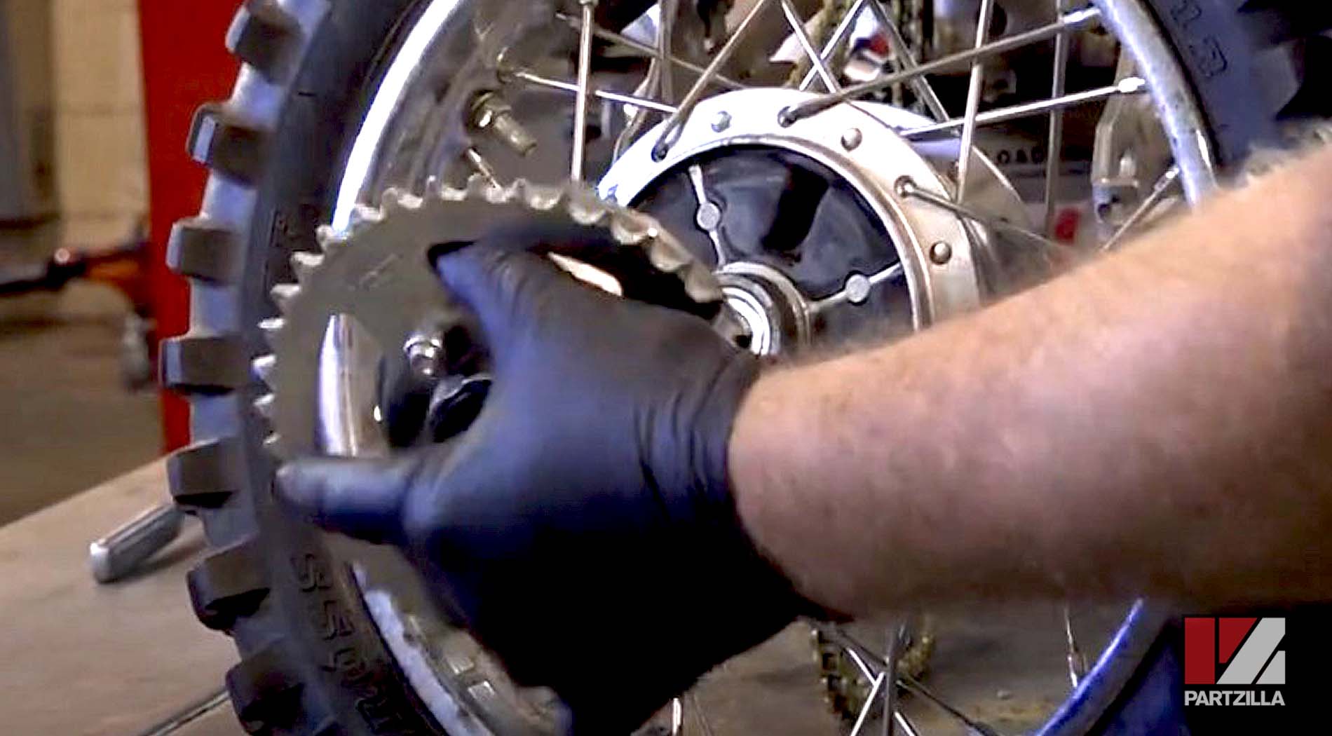 Kawasaki KLX110 dirt bike rear tire removal sprocket