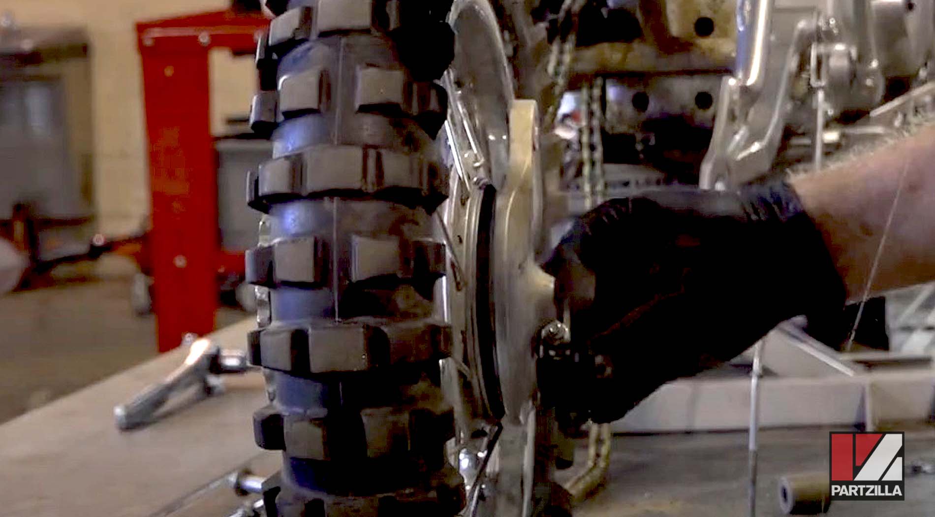 Kawasaki KLX110 dirt bike rear tire removal brake hub