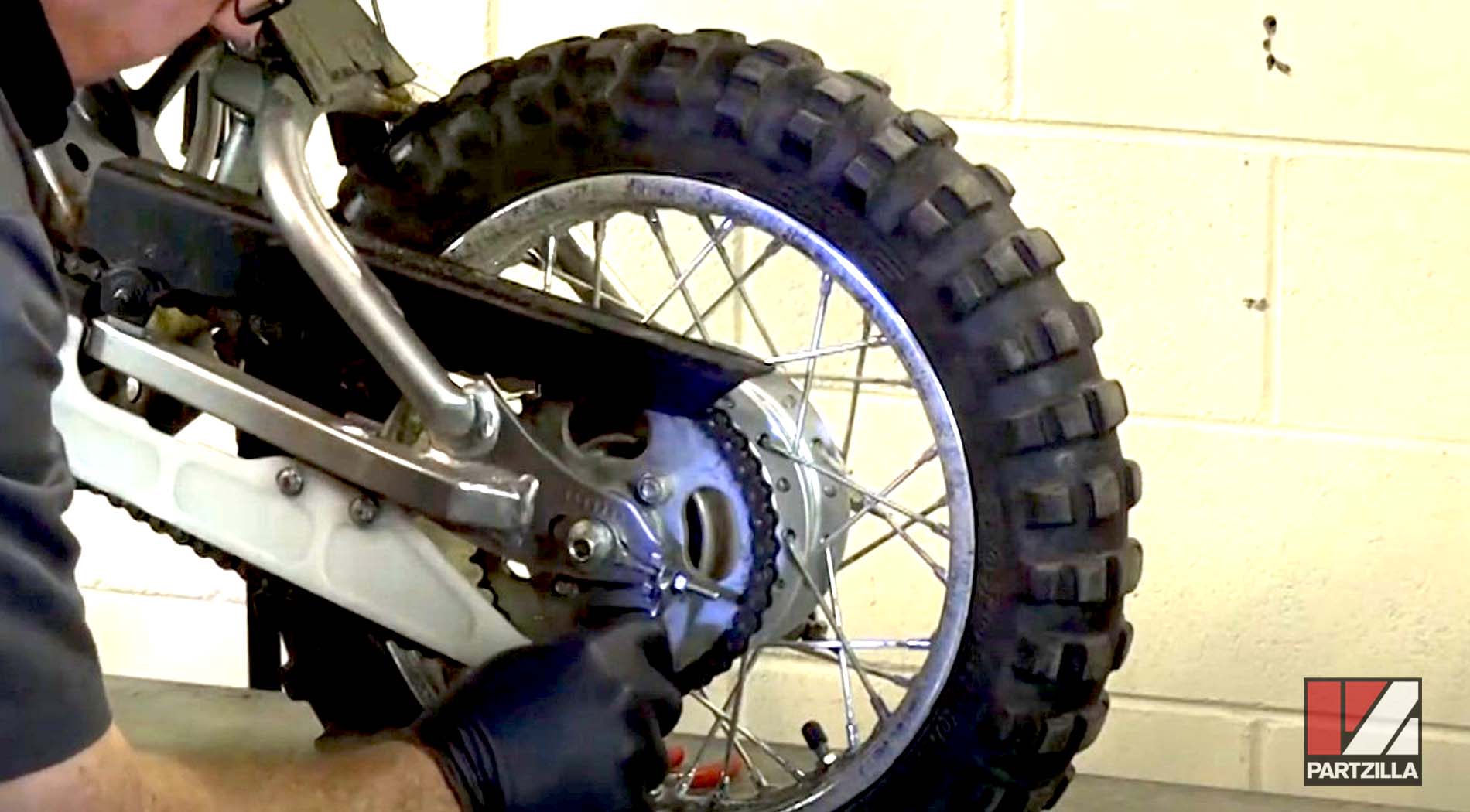 Kawasaki KLX 110 dirt bike chain adjust