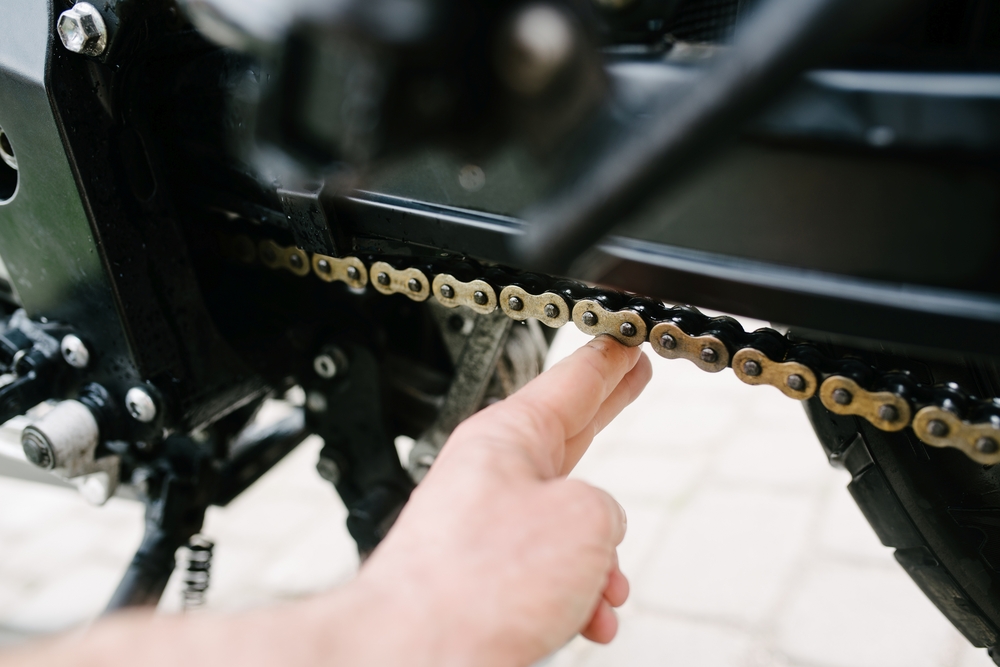 Motorcycle chain tension finger measurement