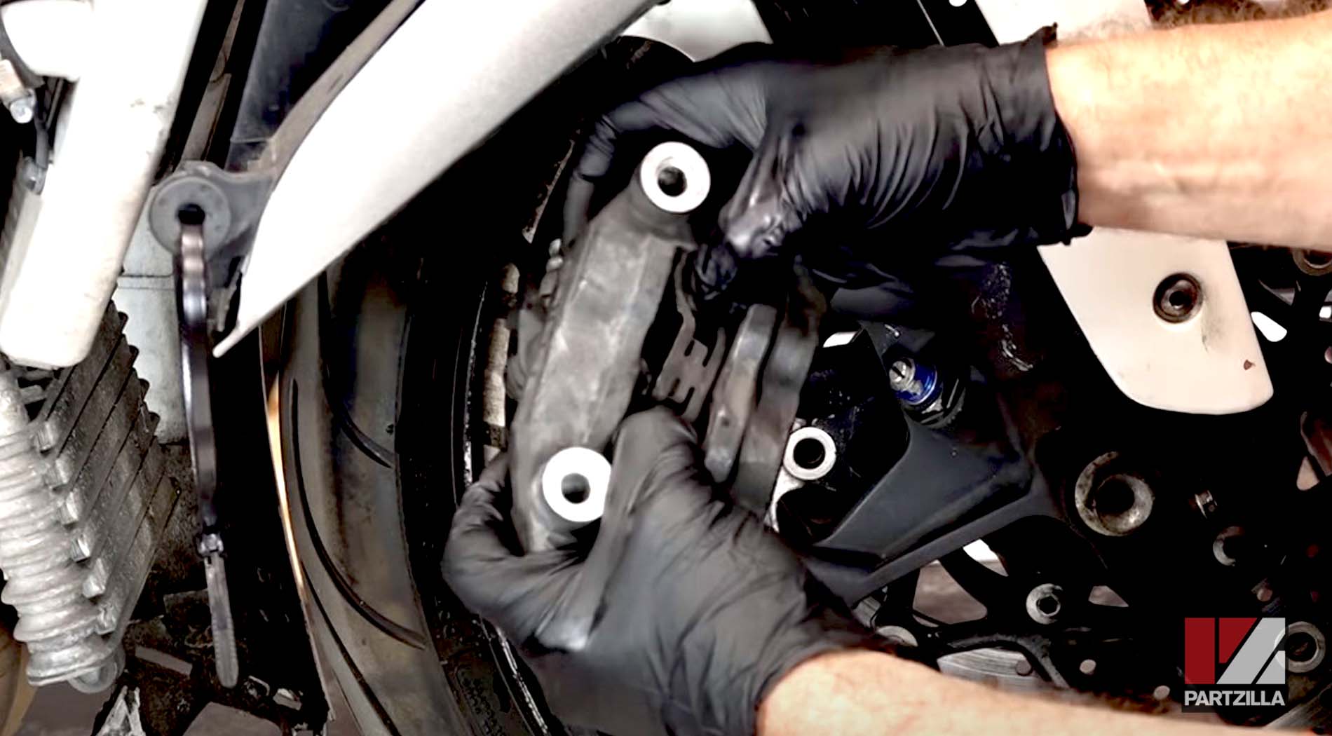 Suzuki GSXR motorcycle front brake caliper rebuild