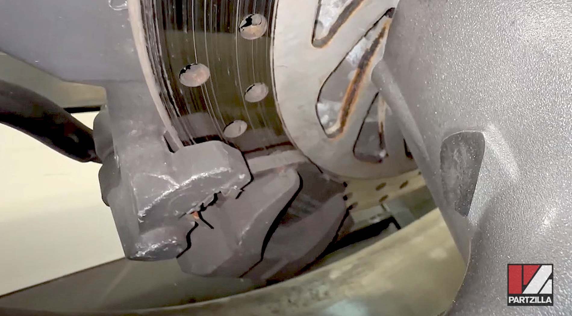 Yamaha motorcycle rear brake pads inspection