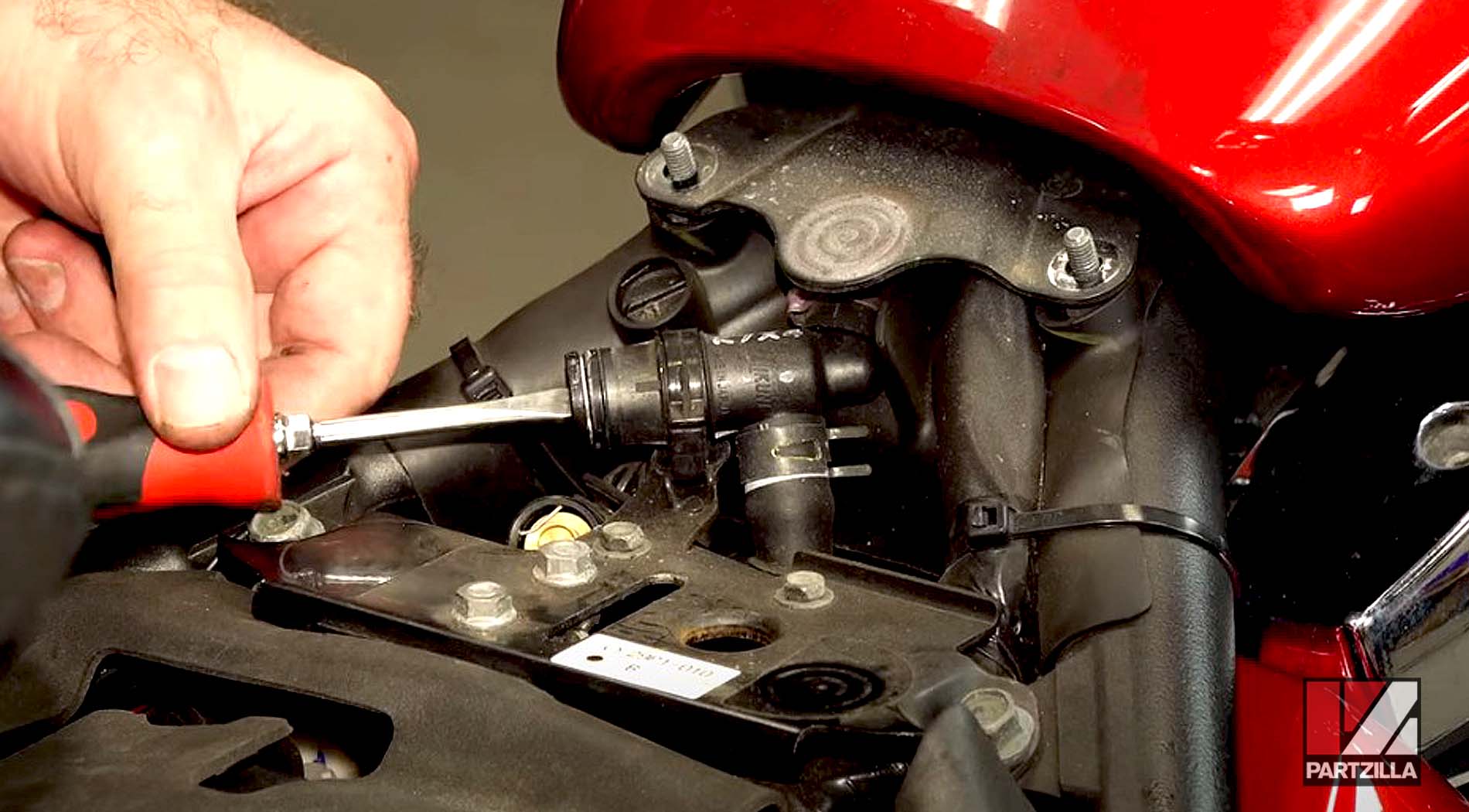 How to replace Yamaha Raider motorcycle spark plugs